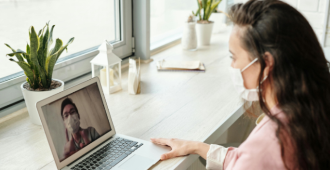 person in mask on video call